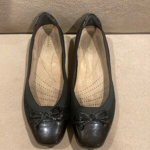 Clarks black leather flats with bows  black rubber sole size 7  good used